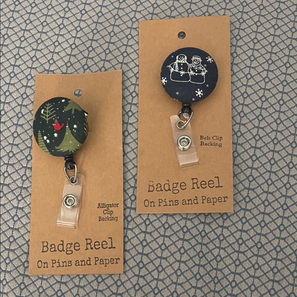 Set of 2 New Badge Reels - Festive winter patterns Navy blue background.